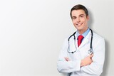 Fototapeta Na drzwi - Happy young doctor in a white coat posing