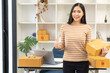 © ArLawKa - SME Startup Business Ideas, Young Entrepreneurs small business owners work at home with laptop and box Packaging and delivery situation Woman Small business owner packing goods in boxes.