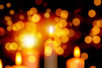 Wall Mural - Many burning candles with beautiful bokeh light background