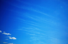 Minimalistic Feather Clouds In Daylight Background