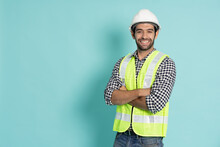 Portrait Of Young Professional Heavy Industry Engineer Or Worker Isolated On Green Background