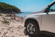 © phpetrunina14 - white suv car at summer sea beach