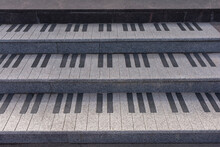 Old Shabby And Worn Outdoor Steps In The Form Of Piano Keys Made Of Marble