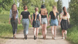 © Довидович Михаил - Schoolgirl friends are walking outside the city along a forest road.