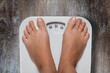 © BillionPhotos.com - obesity and overweight, overweight woman feet on the scale, obesity and bad habits concept.