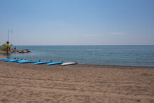 Stand Up Papple Boards (SUPS) Arrayed On A Lake Ontario Beach And Available For Rental. Room For Text