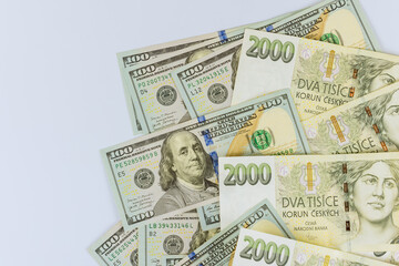 Wall Mural - Czech korunas CZK banknotes money and American hundred dollar currency