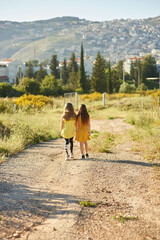 two cute girls on beautiful nature in summer