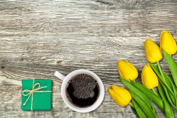 Sticker - Beautiful fresh tulips with a cup of coffee and gifts box.