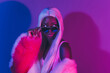 © Beauty Hero - Portrait of young tempting bad girl wear high fashion couture style clothes isolated on fluorescent pink background
