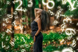 © Nikolay - numerology, beautiful girl standing in the forest, surrounded by numbers