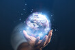© Treecha - concept of future world technology By the earth in the hands of man. Earth day. Energy saving concept. Elements of this image furnished by NASA.