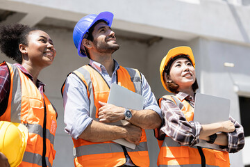 Team Construction or engineering group and worker. Teamwork and determination to succeed. Safety hard hat to prevent accident while working Transport and Container Team. Concept Restart and new Normal