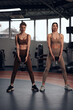 © astrosystem - Pretty women working out in a gym. Adult ladies with beautiful shaped bodies.