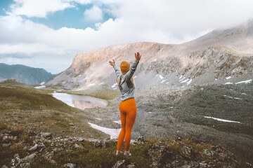 woman tourist enjoying lake view in mountains travel hiking outdoor adventure active vacations trip 