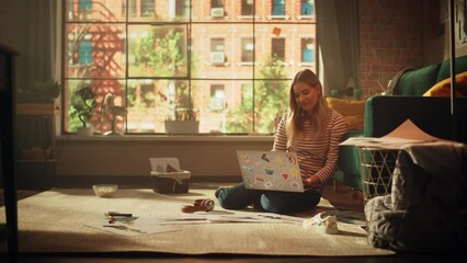 Poster - Beautiful Woman Using Laptop at Home for Remote Work. Young Adult Smiling Woman Sitting on the Floor Uses Internet, Writes Report, Finishes Project. Good Sunny Day for Productive Distant Work