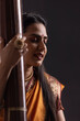 © IndiaPix - Close-up view of a female musician performing with Tanpura at concert