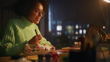 Aufkleber - Creative Black Female Designer Applying her Own Patterns on Shoe by Prototype of 3D Model at Laptop Screen. Stylish Studio During the Evening. New Generation Concept