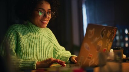 Poster - Positive Black Female Software Engineer Coding on Laptop Computer while Working with Inspiration in her Studio. Woman Studying Late at Evening. Modern Freelancer at Remote Work Concept