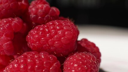 Wall Mural - Close-up of fresh raspberries. Beautiful raspberry background. Macro raspberry.