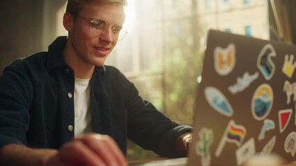 Poster - Focused Male Software Engineer Codding on Laptop Computer while Working with Inspiration in Modern Loft Flat. Modern Man Creating Something New. Modern Freelancer at Remote Work Concept