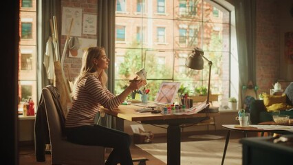Aufkleber - Blonde Female Artist Feeling Satisfied while Refreshing Sneakers in front of her Laptop Computer in Creative Environment. Girl Drawing on the Shoes. Fashion Concept