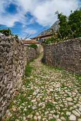 Wall Mural - Old cobbled street and traditional stone houses within the old castle in Kruja, Albania