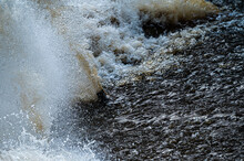 Close Up Of Flowing Water, Rapid Water Splashes Of An White Water River Or Stream, Bubbly Water