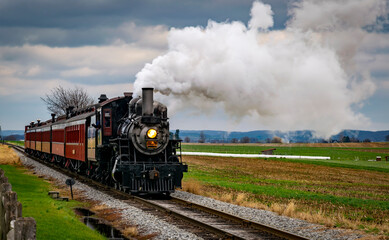 Canvas Print - A Antique Restored Steam Engine and Coaches Approach Thru Corn Fields on a Sunny Day