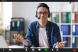 © Prostock-studio - Teleconference. Videocall screenshot of smiling young man in headset having web chat