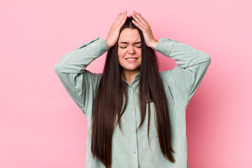 Poster - young adult woman feeling stressed and anxious, depressed and frustrated with a headache, raising both hands to head