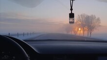 Sunrise From A Car Windshield In Winter Frost