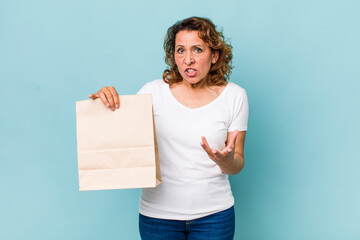 Wall Mural - middle age woman looking angry, annoyed and frustrated. take away concept