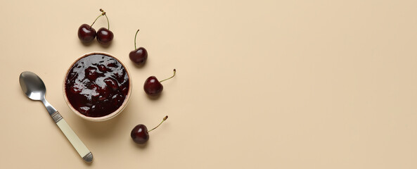 Wall Mural - Bowl of tasty cherry jam on color background with space for text