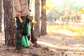 Male tourist with survival kit in forest