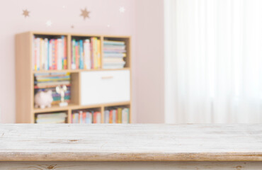 Wall Mural - empty desk for product display on defocused children room background