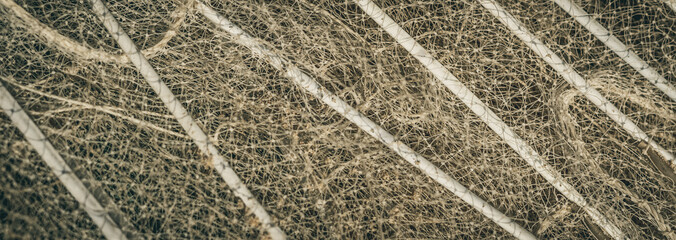 BANNER abstract close-up macro real photo beautiful wallpaper. Fisherman rope net texture fiber surface pattern. Sea blue green light colour. Futuristic subtle waving lines art modern. Pale background