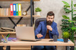 © be free - mature entrepreneur working on computer going to drink coffee at office, check email