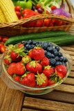 Fototapeta Mapy - Fresh healthy strawberries and other fruits on a wooden table
