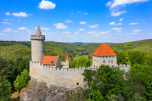 Aerial View Of Medieval Castle Kokorin Nearby Prague In Czechia. Central Europe. Medieval Gothic Castle Kokorin, Kokorinsko Protected Landscape Area In Czech Republic. Medieval Gothic Castle Kokorin.