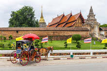 A Horse-drawn Carriage, The Symbol Of The Province, Is In Front Of Wat Phra That Lampang Luang. In Lampang Province, Thailand