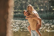 © zinkevych - Romantic man giving his girlfriend a piggyback ride