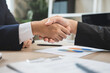 © Pormezz - group of successful business people meeting. client and suppliers shaking hands after deal agreement completed.