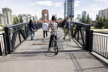 Multiethnic Teen Skaters Crossing, Bridge, City, Park,