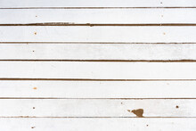 Background Of White Painted Rustic Wooden Slats Arranged Horizontally, Dirty With Sand.