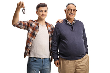 Wall Mural - Guy holding car key and holding an elderly man on the shoulder