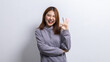 © kamiphotos - Portrait of beautiful Asian woman doing cheerful pose on isolated background, portrait concept used for advertisement and signage, isolated over white background, copy space.