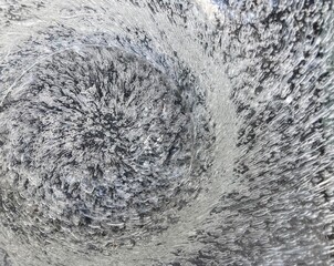 Wall Mural - Air bubbles arranged in a circle in a glass surface