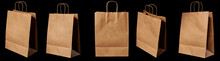 A Brown Paper Bag In Different Angles, Isolated On A Black Background.