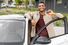 African American Man Standing Next To A Car Showing Thumbs Up While Buying A Car.